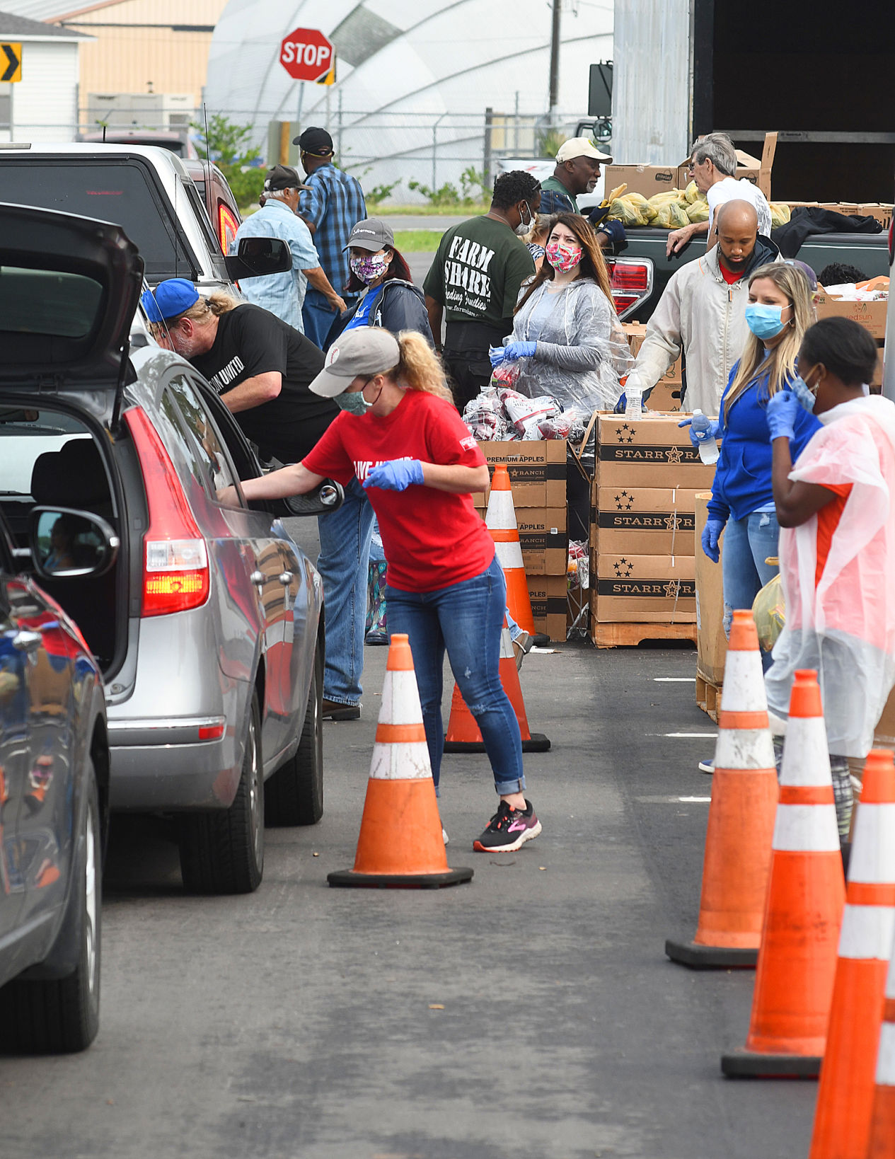 Volunteers work the car line